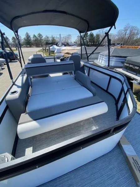 Slide: The Image of 2023 Qwest 824 E-Class Splash Pad Rw LTZ pontoon boat with spacious seating and canopy. - 9