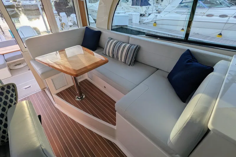 Slide: The Image of Luxurious interior of 2024 Back Cove 39O yacht with elegant seating and wooden table. - 28