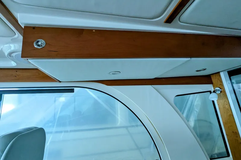 Slide: The Image of Interior view of 2024 Back Cove 39O yacht, featuring wood accents and modern design elements. - 31