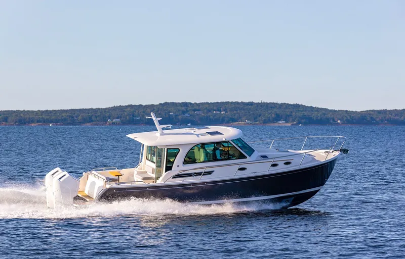 Slide: The Image of 2024 Back Cove 39O cruising on open water, showcasing sleek design and powerful performance. - 4