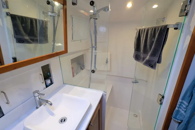Slide: The Image of Modern bathroom in 2024 Back Cove 39O yacht with glass shower and sleek fixtures. - 43