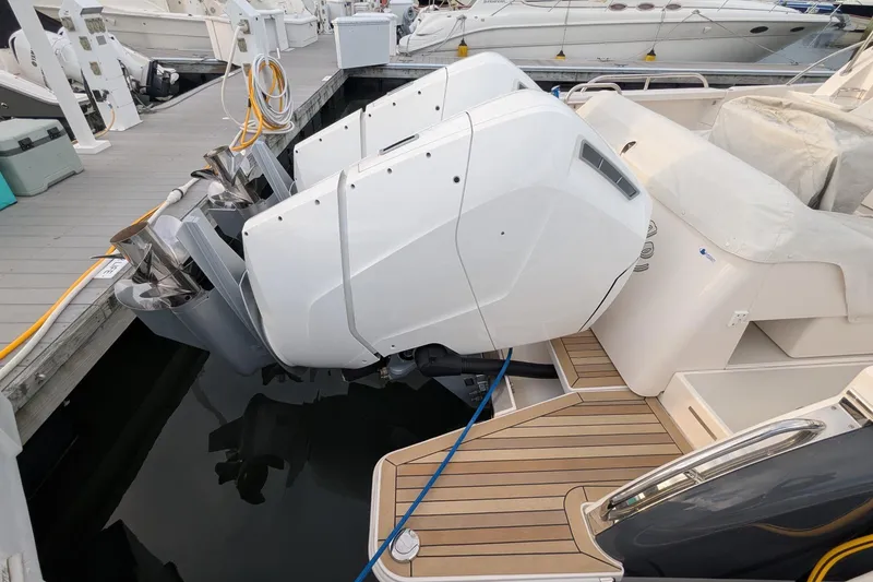 Slide: The Image of 2024 Back Cove 39O boat with powerful outboard engines docked at marina. - 8