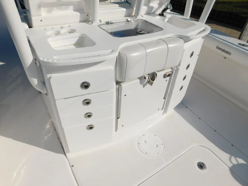 Slide: The Image of 2016 Everglades 355 Center Console boat interior with storage and sink. - 12
