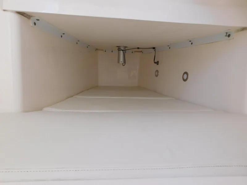 Slide: The Image of Interior storage compartment of 2016 Everglades 355 Center Console boat. - 42