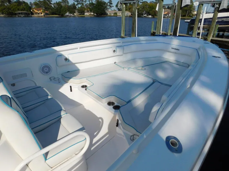 Slide: The Image of 2016 Everglades 355 Center Console boat interior with spacious seating and water view. - 6