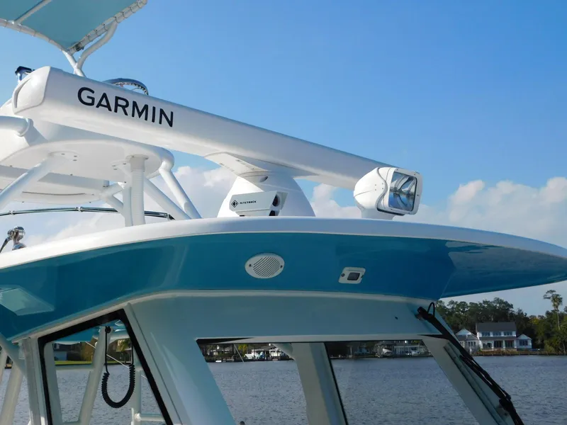 Slide: The Image of Everglades 355 Center Console 2016 boat with Garmin radar, blue sky background. - 8