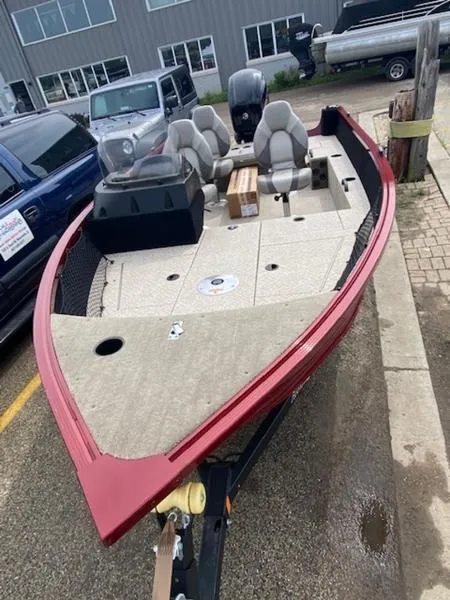 Slide: The Image of 2022 Alumacraft Competitor 165 CS fishing boat with red exterior and spacious seating. - 3