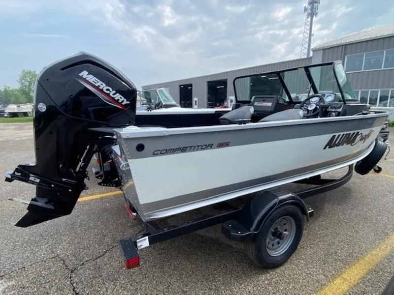 Slide: The Image of 2022 Alumacraft Competitor 165 Sport boat with Mercury engine on trailer. - 1