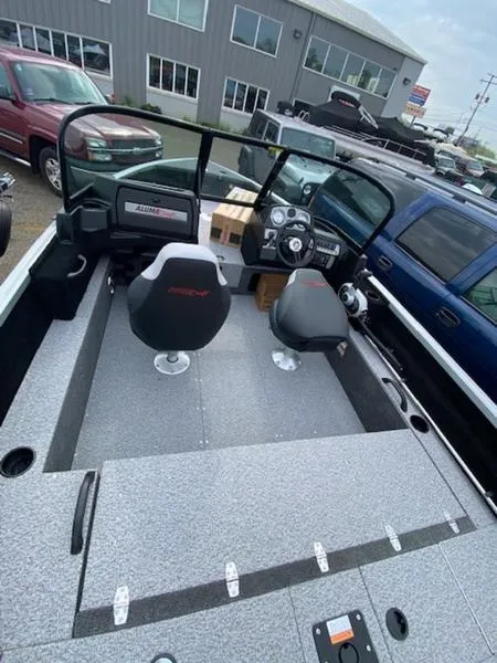 Slide: The Image of 2022 Alumacraft Competitor 165 Sport boat interior with seating and dashboard. - 3