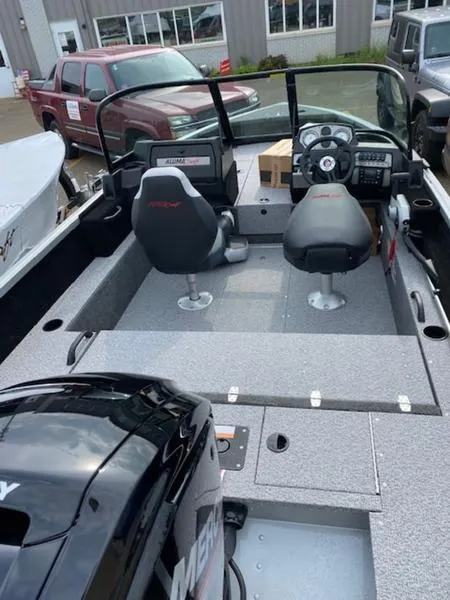 Slide: The Image of 2022 Alumacraft Competitor 165 Sport boat interior with seating and controls. - 4