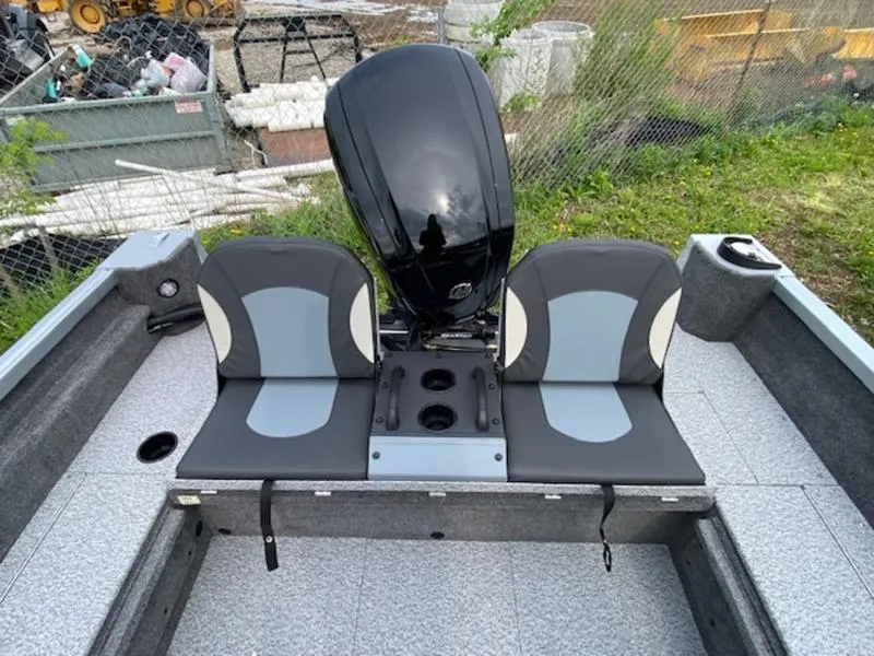 Slide: The Image of 2022 Alumacraft Voyageur 175 Sport boat interior with dual seats and motor. - 5