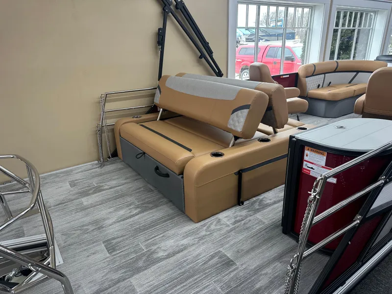 Slide: The Image of 2025 Crest Classic 200 boat interior with tan seating and modern design. - 10