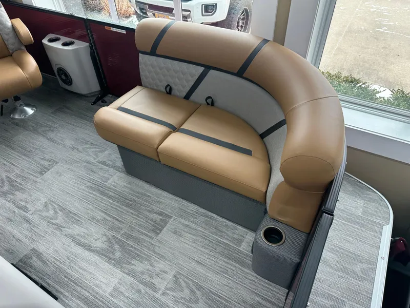 Slide: The Image of Luxurious seating in 2025 Crest Classic 200 boat, featuring tan and gray upholstery. - 3