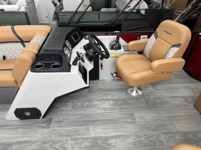 Slide: The Image of 2025 Crest Classic 200 boat interior with tan seating and modern dashboard. - 6