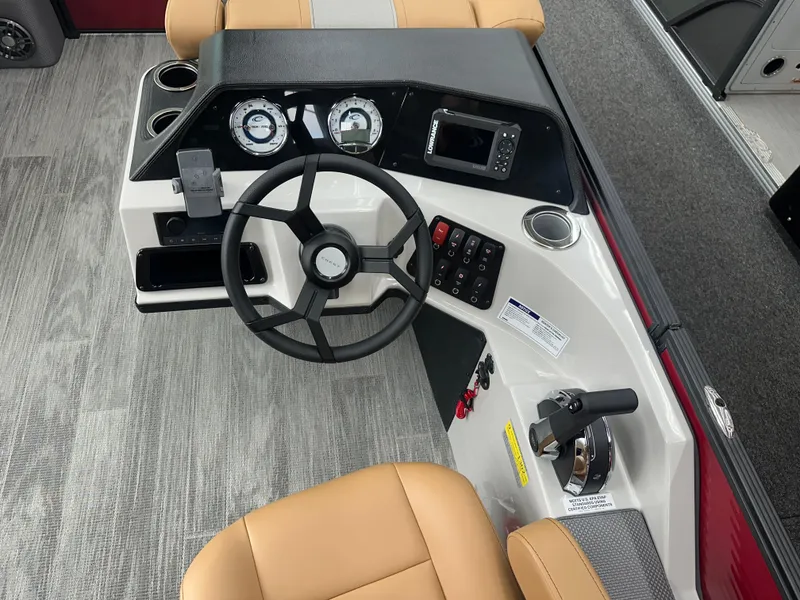 Slide: The Image of 2025 Crest Classic 200 boat dashboard with steering wheel and control panel. - 8