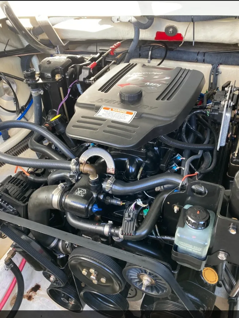 Slide: The Image of Engine of a 2005 Formula 330 Sun Sport boat, showcasing intricate components and wiring. - 12