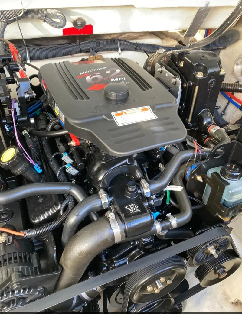 Slide: The Image of 2005 Formula 330 Sun Sport engine compartment with MerCruiser MPI engine. - 13