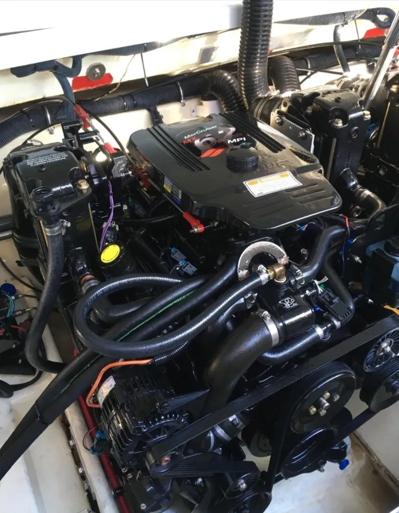 Slide: The Image of Engine of 2005 Formula 330 Sun Sport boat, showcasing intricate mechanical components. - 15