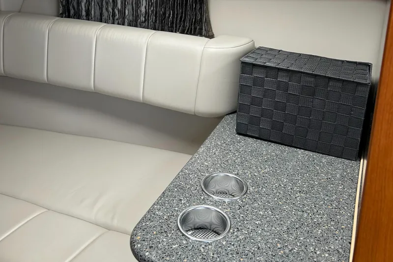 Slide: The Image of 2005 Formula 330 Sun Sport interior with white seating and countertop. - 6