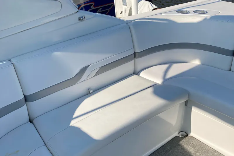 Slide: The Image of 2005 Formula 330 Sun Sport boat interior with white seating and gray accents. - 9