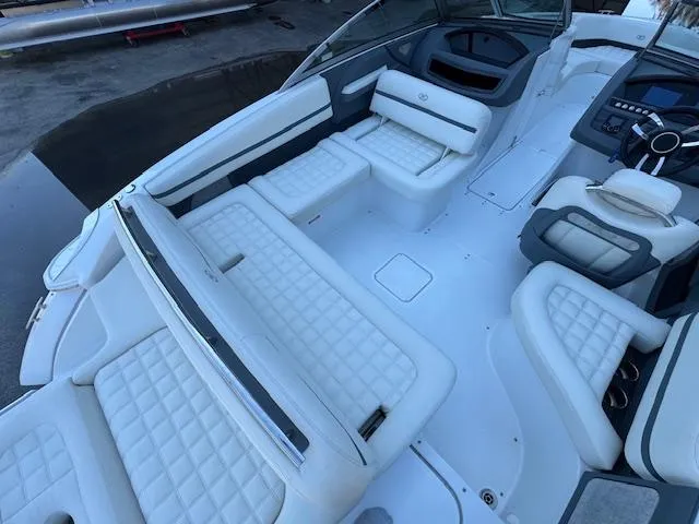 Slide: The Image of 2018 Cobalt R3 boat interior with white quilted seating and modern dashboard. - 12