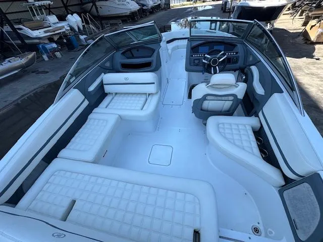 Slide: The Image of 2018 Cobalt R3 boat interior with white seating and modern dashboard. - 13