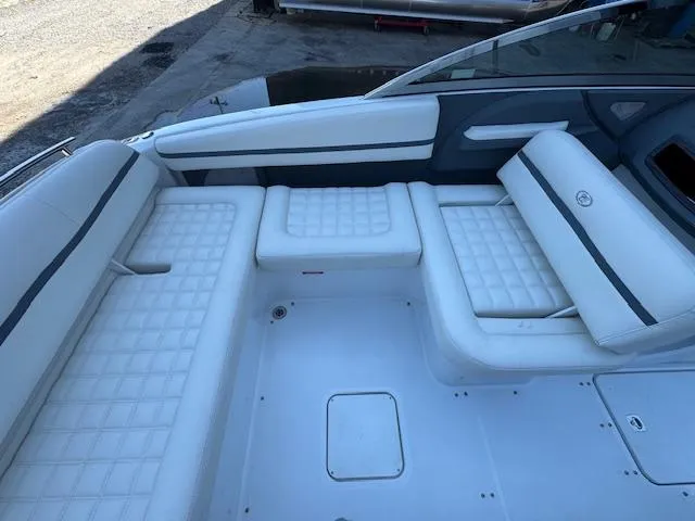 Slide: The Image of 2018 Cobalt R3 boat interior with white cushioned seating and sleek design. - 15