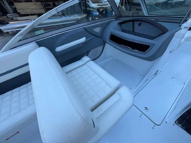 Slide: The Image of 2018 Cobalt R3 boat interior with white seating and dashboard. - 16