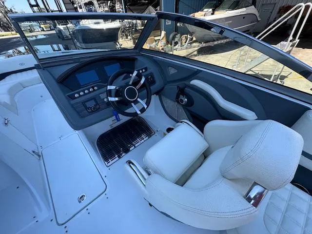 Slide: The Image of 2018 Cobalt R3 boat cockpit with modern steering and white seating. - 17