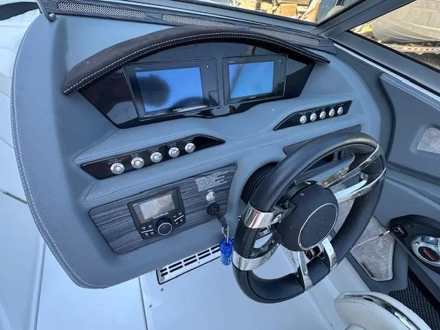 Slide: The Image of 2018 Cobalt R3 boat dashboard with dual screens and modern controls. - 18