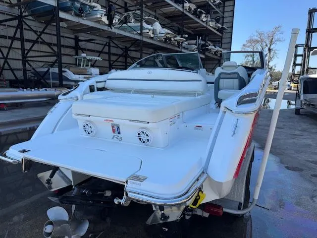 Slide: The Image of 2018 Cobalt R3 boat in storage, rear view, showcasing spacious deck and seating. - 4