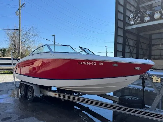 Slide: The Image of 2018 Cobalt R3 boat on trailer, red and white design, parked outdoors. - 9