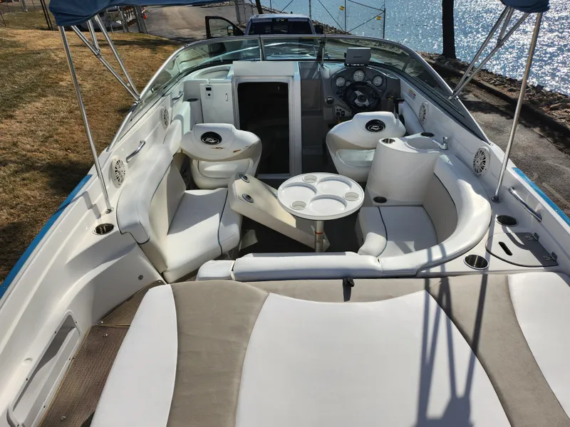 Slide: The Image of 2007 Rinker 246 Captiva Cuddy boat interior with seating and steering console. - 10