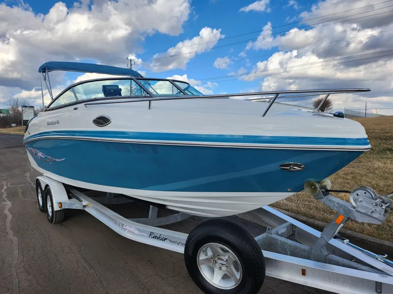 Slide: The Image of 2007 Rinker 246 Captiva Cuddy boat on trailer under blue sky. - 5