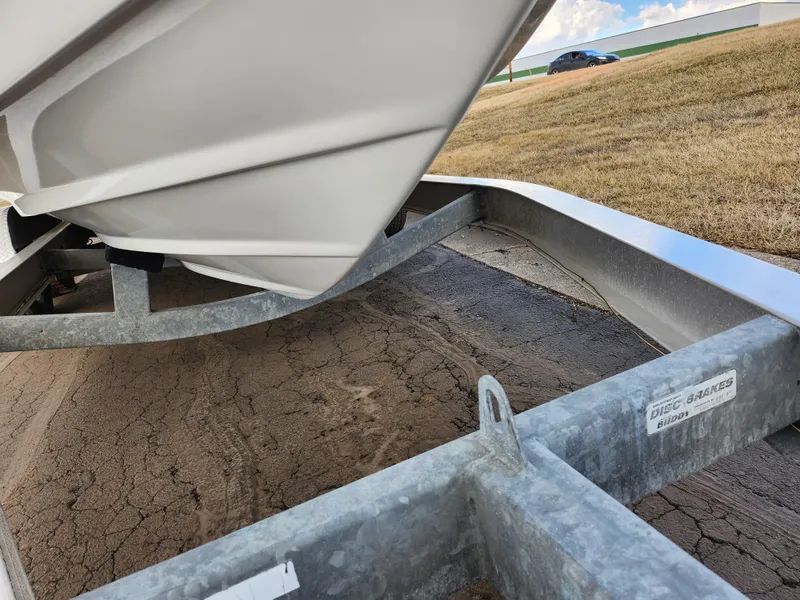 Slide: The Image of 2007 Rinker 246 Captiva Cuddy boat on a trailer, close-up view. - 7