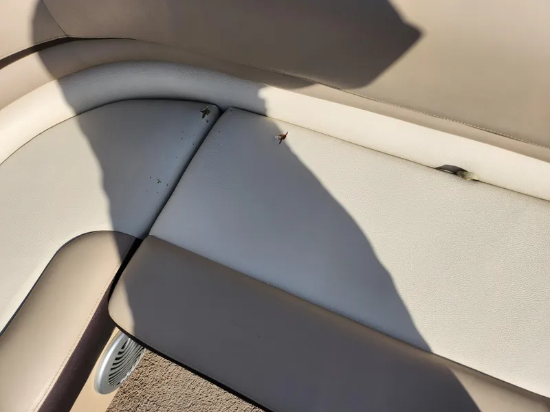 Slide: The Image of 2015 Sun Tracker Party Barge 20 DLX interior seating with beige upholstery. - 15