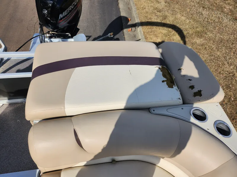 Slide: The Image of 2015 Sun Tracker Party Barge 20 DLX with worn beige seating and Mercury motor. - 16