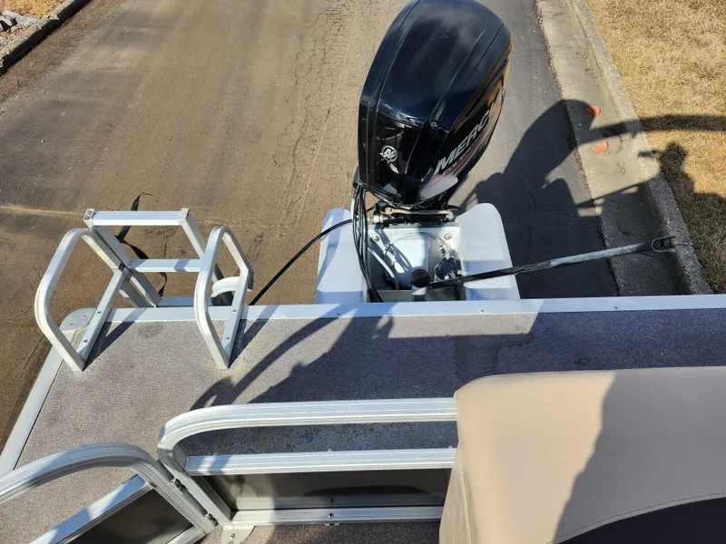 Slide: The Image of 2015 Sun Tracker Party Barge 20 DLX with outboard motor, rear deck view. - 18