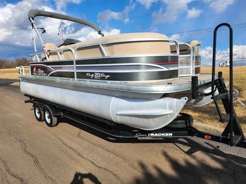Slide: The Image of 2015 Sun Tracker Party Barge 20 DLX pontoon boat on trailer, parked on road. - 5