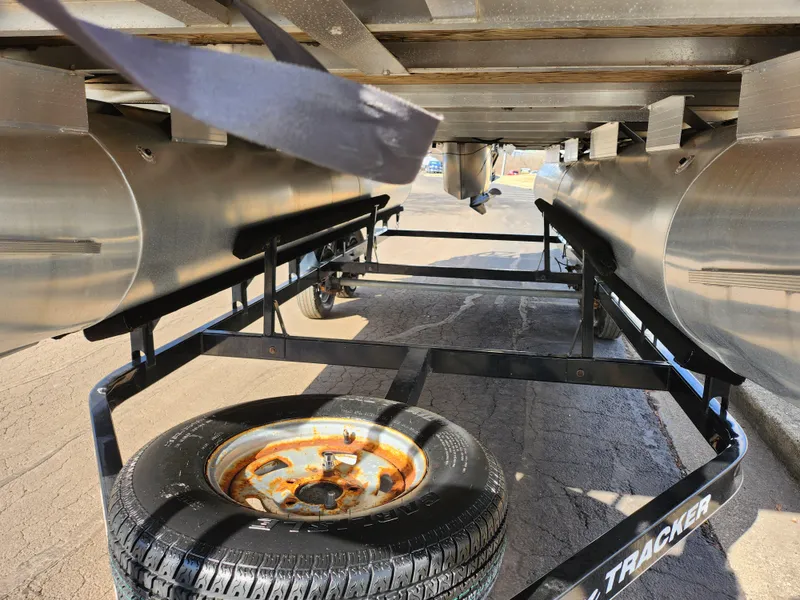 Slide: The Image of Underneath view of a 2015 Sun Tracker Party Barge 20 DLX on a trailer. - 7