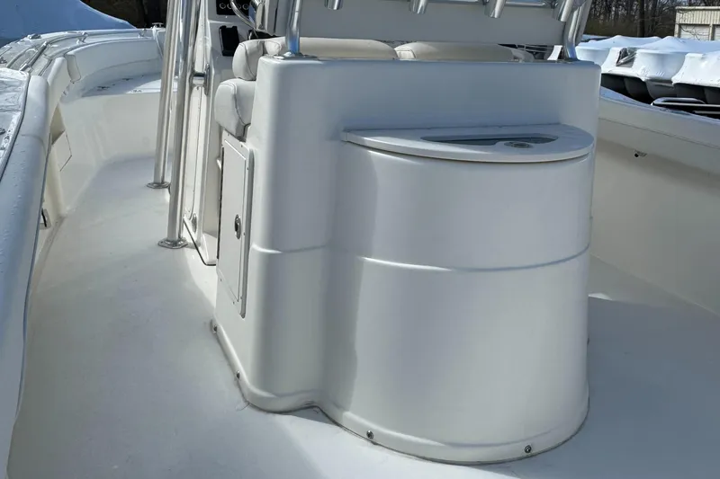 Slide: The Image of 2025 Key West 239FS boat interior, featuring sleek white console and seating area. - 10