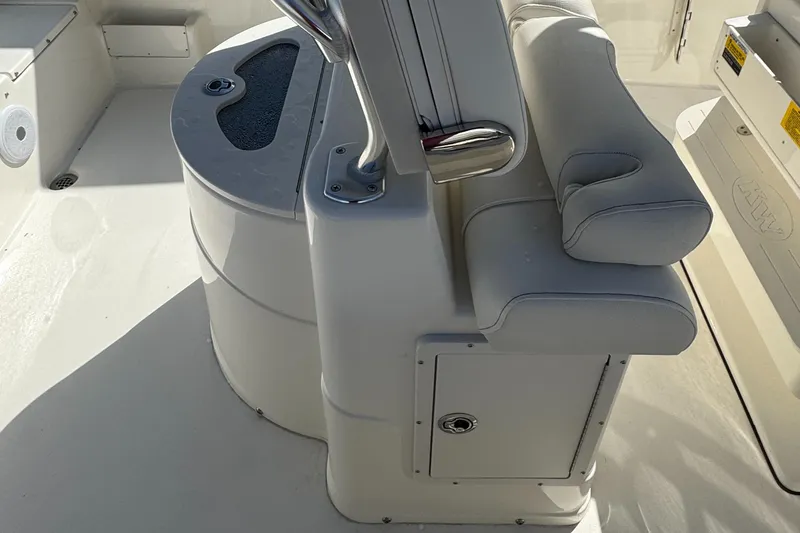 Slide: The Image of 2025 Key West 239FS boat interior with cushioned seating and storage compartments. - 11