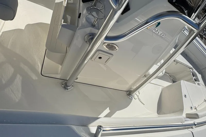 Slide: The Image of 2025 Key West 239FS boat interior with stainless steel railings and console details. - 14