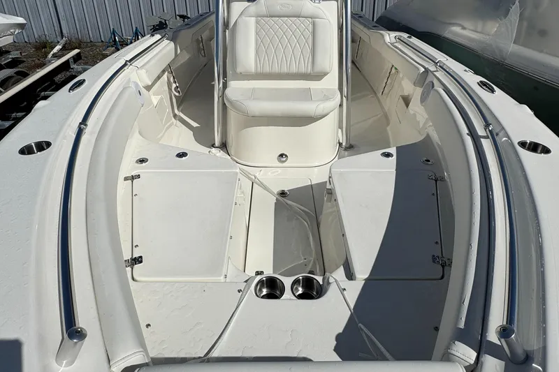 Slide: The Image of 2025 Key West 239FS boat interior with seating and storage compartments. - 15