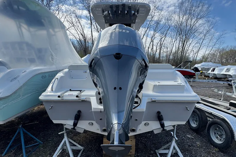 Slide: The Image of 2025 Key West 239FS boat with powerful outboard motor, displayed outdoors on a trailer. - 4
