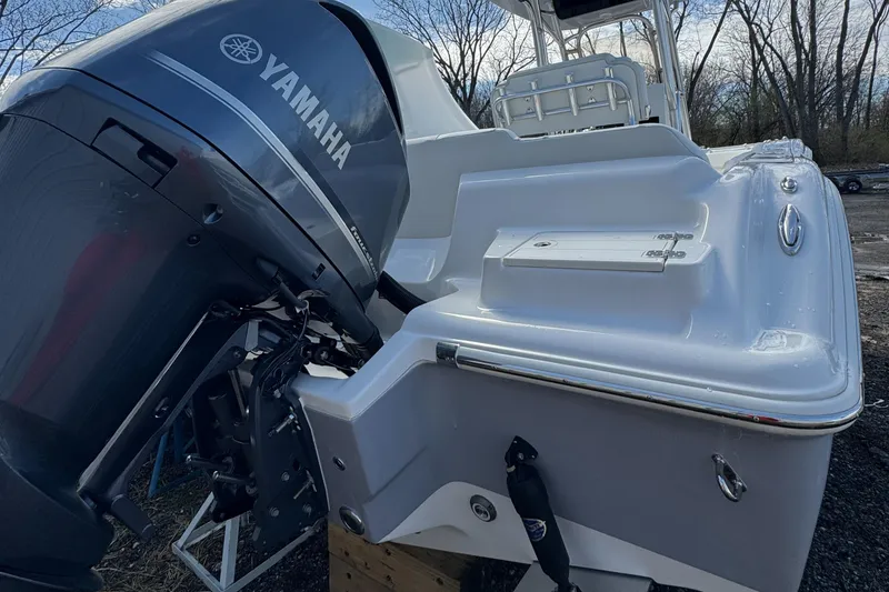 Slide: The Image of 2025 Key West 239FS boat with Yamaha outboard motor, parked outdoors. - 5