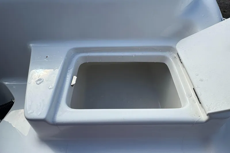 Slide: The Image of Open storage compartment on a 2025 Key West 239FS boat. - 6