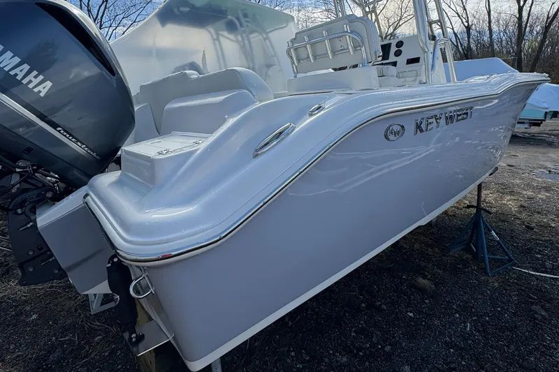 Slide: The Image of 2025 Key West 239FS boat with Yamaha engine, parked outdoors. - 7