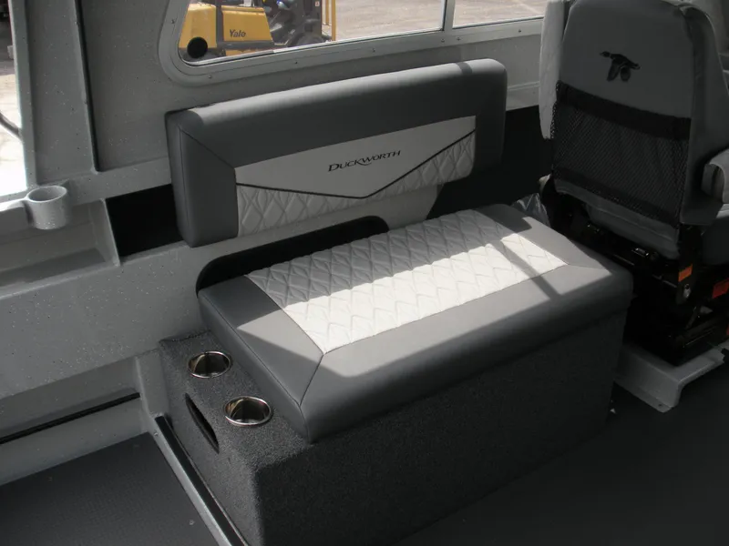 Slide: The Image of Interior seating of 2025 Duckworth 24 Pacific Pro boat with cup holders. - 17