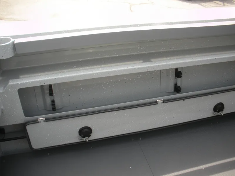 Slide: The Image of 2025 Duckworth 24 Pacific Pro boat storage compartment, open and empty, showcasing interior space. - 21